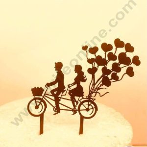 CAKE DECOR™ 5 inch Acrylic Cute Couple On Bicycle with Heart Shape Balloons Cutout Design Cake Topper Cake Decoration Dessert Decoration (SBMT-3031)